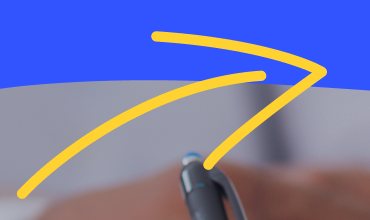 Detail: two hand-drawn yellow arrows crossing a blue wave